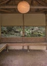 Japanese tea house lit by a lantern of paper overlooking a water Royalty Free Stock Photo