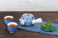 Japanese teapot with cups and mint Royalty Free Stock Photo