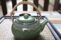 Japanese teapot hot tea with cup green antique ceramic for healthy drink set on table wooden background Royalty Free Stock Photo