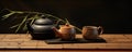 Japanese teapot on wooden table. Tea cups Royalty Free Stock Photo