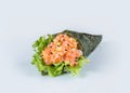 Japanese Temaki Hand Roll Sushi with raw Sake salmon, flying fish roe Tobiko caviar, avocado, salad leaf, rice, black and white Royalty Free Stock Photo