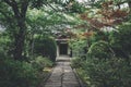 Japanese temple with japanese maple tree leaves in Kyoto vintage film style Royalty Free Stock Photo