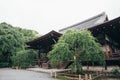 Japanese temple with japanese maple tree leaves in Kyoto vintage film style Royalty Free Stock Photo