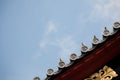 Japanese temple roof against blue sky. Royalty Free Stock Photo