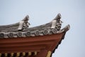 Japanese temple roof against blue sky. Royalty Free Stock Photo