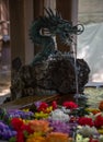 Japanese temple water fountain with a bronze dragon sculpture. Royalty Free Stock Photo