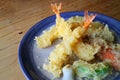 Japanese tempura with fresh vegetables deep fried and shrimp serve on ceramic round plate. Japanese traditional food Royalty Free Stock Photo