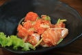 Japanese - Thai fusion food. Hot and sour Salmon sashimi. Thai style spicy salmon salad with mixed vegetables and herbs Royalty Free Stock Photo