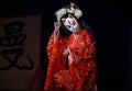 Japanese theater actors perform oriental dance in masks