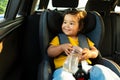 Japanese Toddler Girl Sitting With Comfort in Chair In Automobile Royalty Free Stock Photo