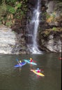 Japanese enjoy kayaking in river with waterfall background Royalty Free Stock Photo