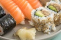 Japanese tuna avocado inside out California with salmon Nigiri and Maki on sushi mix plate Royalty Free Stock Photo
