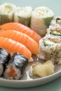 Japanese tuna avocado inside out California with salmon Nigiri and Maki on sushi mix plate Royalty Free Stock Photo