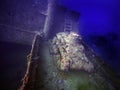 A Japanese Type 95 Ha-Go light tank on the deck of a cargo ship sunk in Truk Lagoon