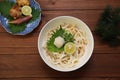 Japanese udon dishes sprinkling soup stock to noodles directly