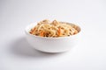 Japanese wheat noodles with chicken, a dish of Asian cuisine in a white bowl on a white background. Close-up Royalty Free Stock Photo