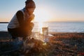 Japanese woman cooking on the seashore Royalty Free Stock Photo