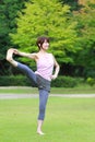 Japanese Woman Doing YOGA Extended Hand-To-Big-Toe Pose Royalty Free Stock Photo