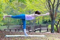 Japanese Woman Doing YOGA warrior III pose Royalty Free Stock Photo