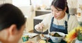 Japanese woman, eating and lunch in restaurant, chopsticks and hungry with plate for nutrition. Girl, people and food Royalty Free Stock Photo