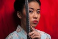 Japanese woman with katana Royalty Free Stock Photo