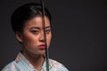 Japanese woman with katana Royalty Free Stock Photo