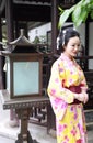 Traditional Asian Japanese woman Geisha wearing kimono play in a graden