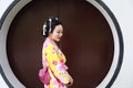 Traditional Asian Japanese beautiful Geisha woman wears kimono in a summer nature
