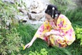 Traditional Asian Japanese woman in a outdoor garden