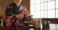 Japanese, woman and matcha for tea ceremony in Chashitsu room with kimono dress and traditional custom. Person, temae