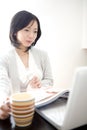 Japanese woman operating a PC Royalty Free Stock Photo