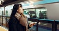 Japanese woman, phone and train station for travel with app, waiting and happy for metro transportation. Girl Royalty Free Stock Photo