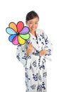 Japanese Woman playing with colorful windmill Royalty Free Stock Photo