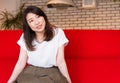 Japanese woman relaxing on the sofa in the living room