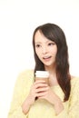 Japanese woman takes a coffee break Royalty Free Stock Photo