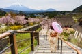 Japanese woman enjoy sakura with mt. Fuji