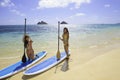 Japanese women on paddleboards Royalty Free Stock Photo