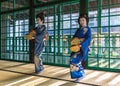 Japanese women wearing kimono dancing with furi-zutsumi tambourines in a free show at Dejima island in Nagasaki. Royalty Free Stock Photo