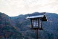 Japanese wooden spirit house, with forest background Royalty Free Stock Photo