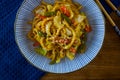 Japanese yaki udon in a blue bowl