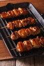 Japanese yakitori skewers of chicken on a grill. vertical close-up Royalty Free Stock Photo