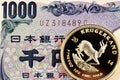 Japanese 1000 yen bank note with a gold Krugerrand coin Royalty Free Stock Photo