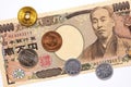 A Japanese 10000 yen note and coins are on a white background. Close-up Royalty Free Stock Photo