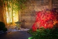 Japanese zen garden lightened by spot lights at night