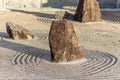 Japanese zen landscape garden, or karesansui, with raked sand or gravel to represent ripples in water. Kurikarafudoji Royalty Free Stock Photo