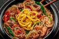 Japchae in black bowl on dark slate table top. Korean cuisine glass chapchae noodles dish with vegetables and meat Royalty Free Stock Photo