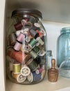 Jar of Antique Thread Spools Many Colors