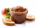 Jar of apple butter next to a slice of bread