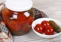 Jar of assorted pickled tomatoes and cucumbers Royalty Free Stock Photo