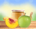 Jar of baby puree, peach, apple and banana on wooden table Royalty Free Stock Photo